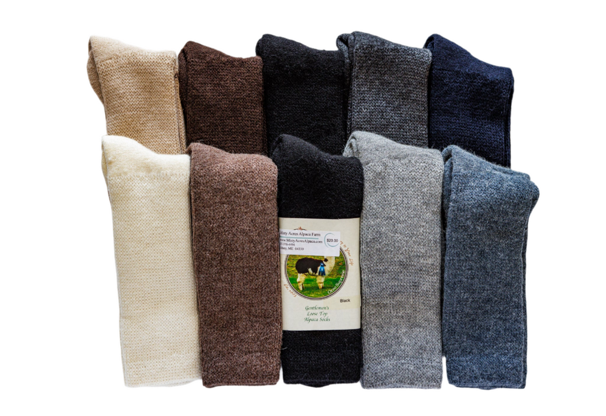 Photo of loose top Alpaca Socks in two rows of 6 in colors black, gray, tan, white, blue and more