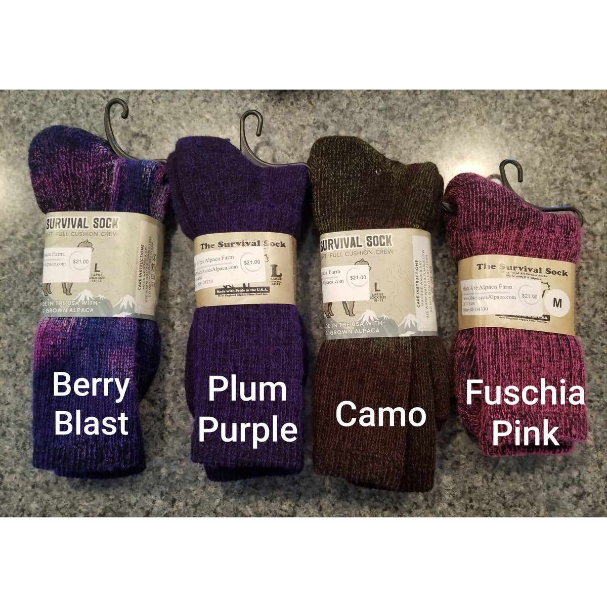 Photo of 4 colors of alpaca survival socks in berry blast, plum purple, camo, fuschia pink