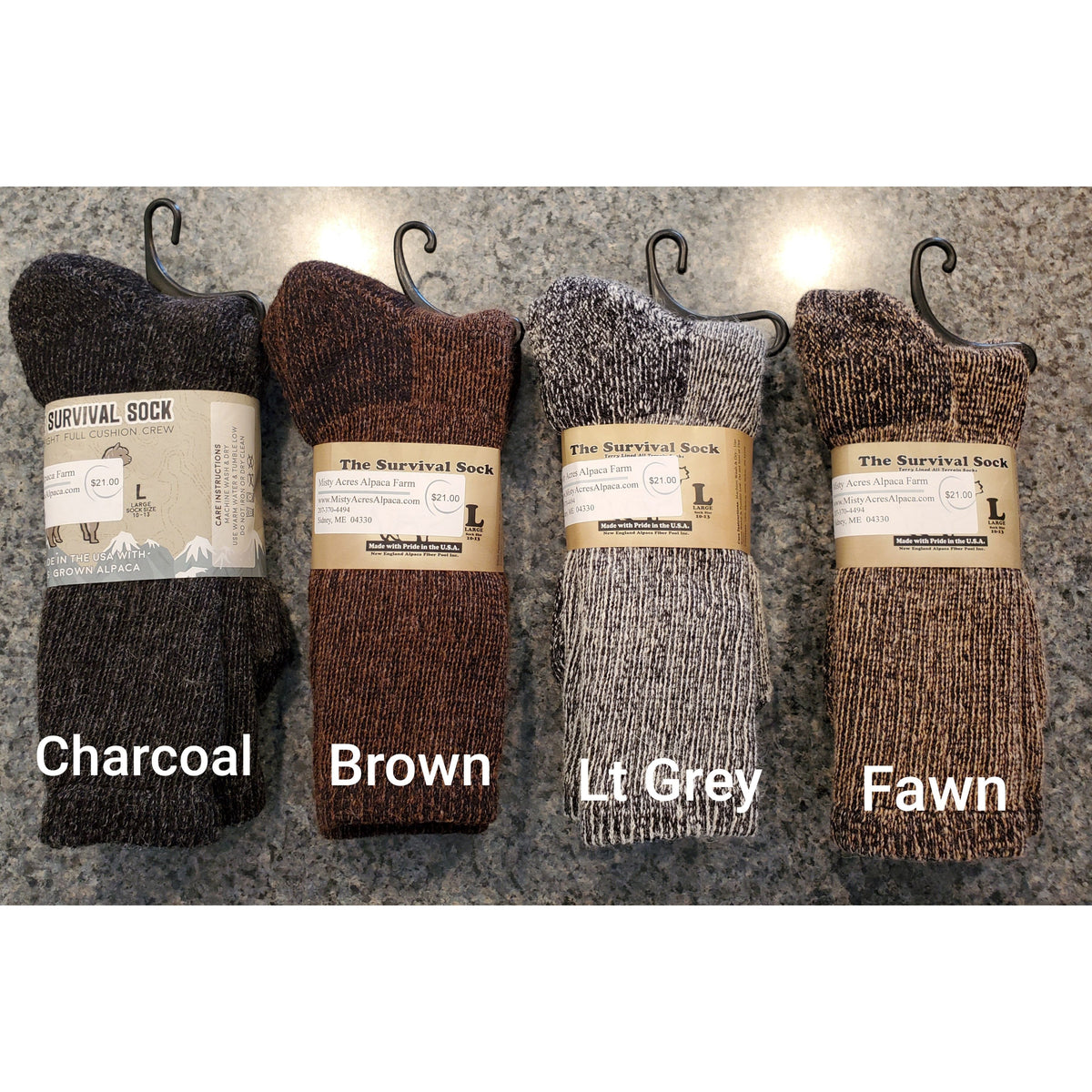 Photo of 4 pairs of retail ready alpaca survival socks in charcoal, brown, lt grey and fawn