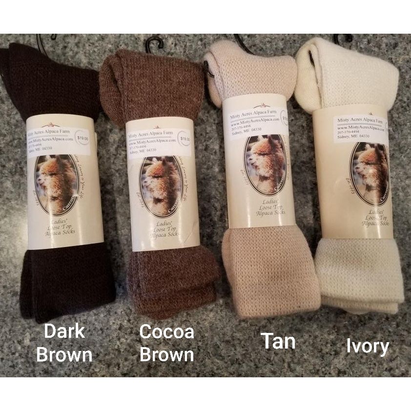 Photo of 4 pairs of loose top alpaca socks in dark brown, cocoa brown, tan and ivory.