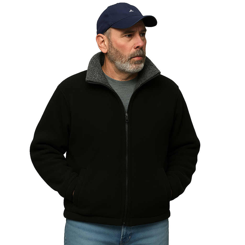 Man wearing a baseball cap and the alpaca barn jacket has hands in pockets and is looking off to the distance