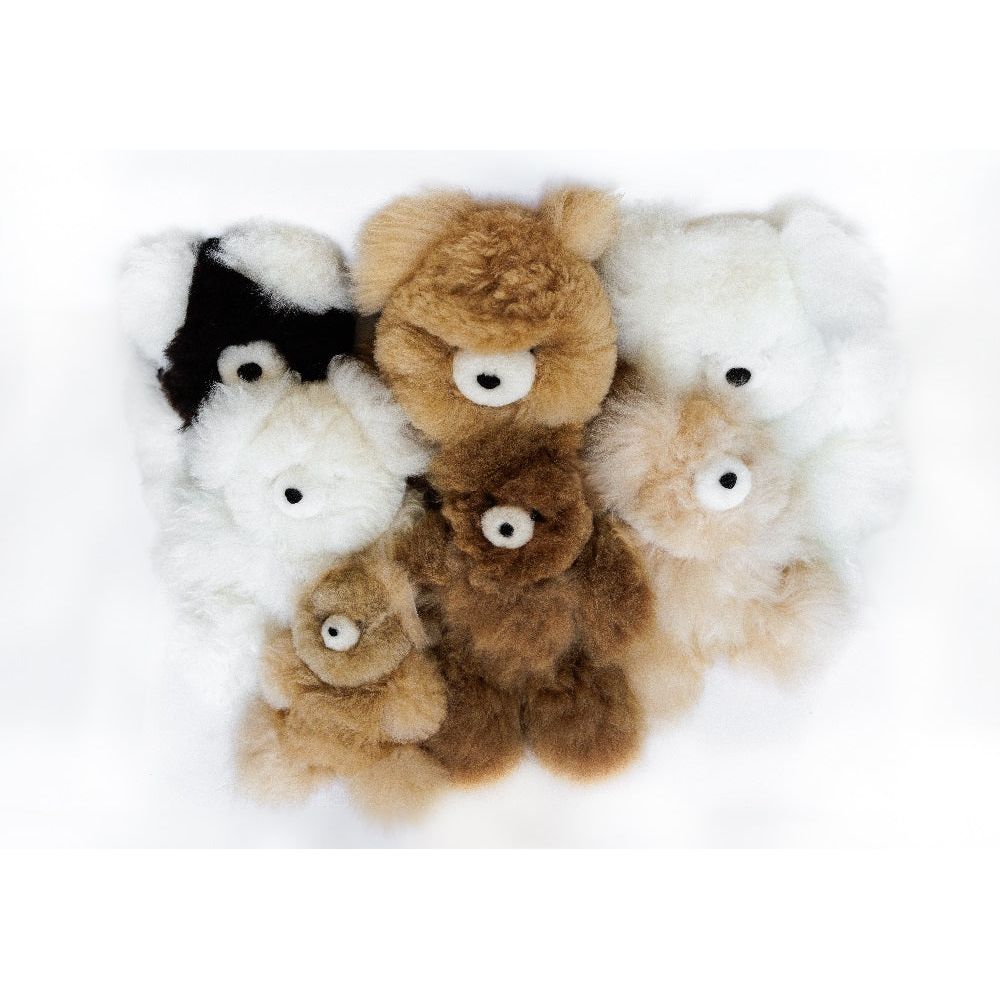 photo of 7 stuffed alpacas crowded together